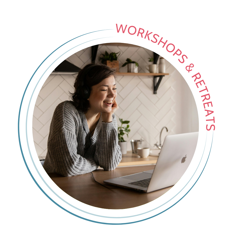 Workshops and retreats button with woman at computer on kitchen counter smiling