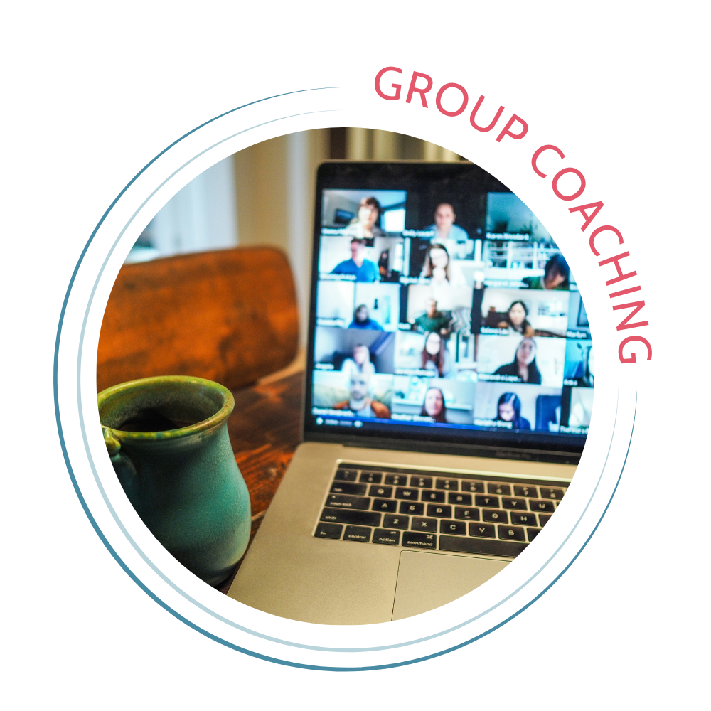Group coaching button with large Zoom meeting on laptop next to coffee mug